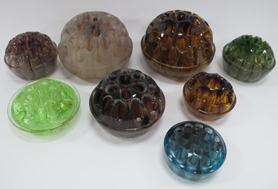 Lot 1166 - Collection of glass flower frogs, in a variety...