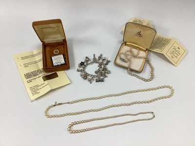 Lot 119 - A Curb Link Charm Bracelet, suspending...