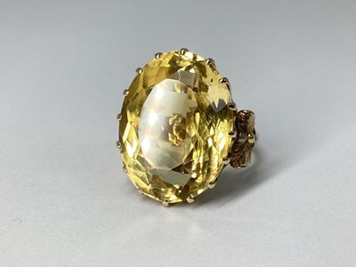 Lot 67 - A Large Citrine Single Stone Dress Ring, oval...