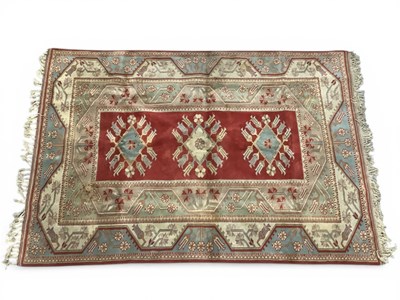 Lot 1550 - Turkish 'Paradise' Tassle rug, with three...