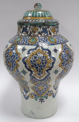 Lot 1310 - Islamic Pottery Urn and Cover with upper...