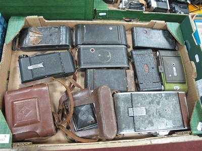 Lot 1097 - A collection of vintage folding cameras to...
