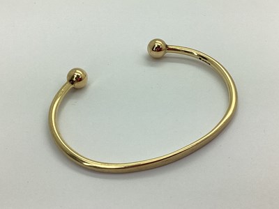 Lot 123 - A 9ct Gold Torque Bangle, (engraved inside...