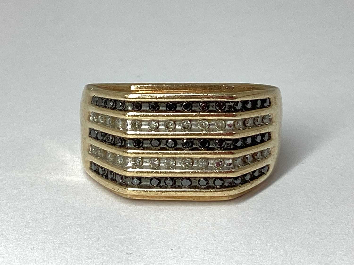 Lot 79 - The Genuine Gemstone Company; A Gent's 9ct...