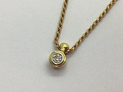 Lot 99 - A Single Stone Rubover Set Diamond Pendant, on...
