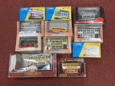 Lot 410 - Eleven diecast model trams and buses by Corgi,...