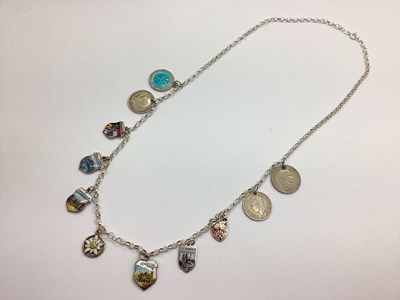 Lot 128 - A Charm Necklace, the modern chain suspending...