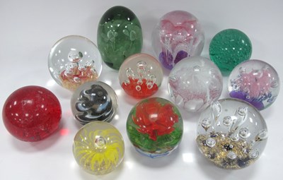 Lot 1224 - Twelve large art glass paperweights in various...