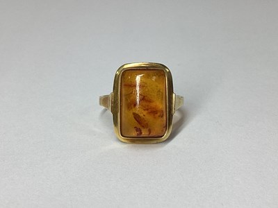 Lot 69 - A Modern Amber Coloured Ring, rectangular...