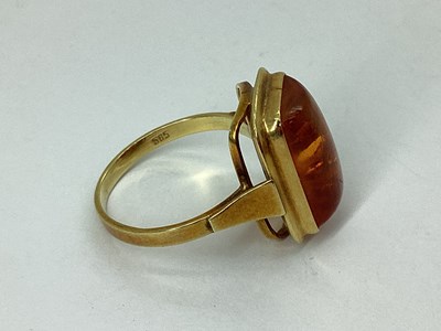 Lot 69 - A Modern Amber Coloured Ring, rectangular...