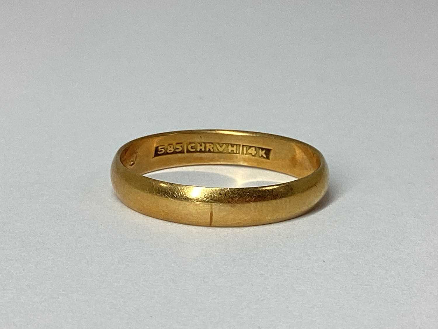Lot 72 - A Plain Wedding Band, stamped "585 CHR.V.H.14K"...