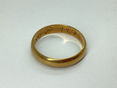 Lot 67 - A Plain Wedding Band, stamped "585 CHR.V.H.14K"...