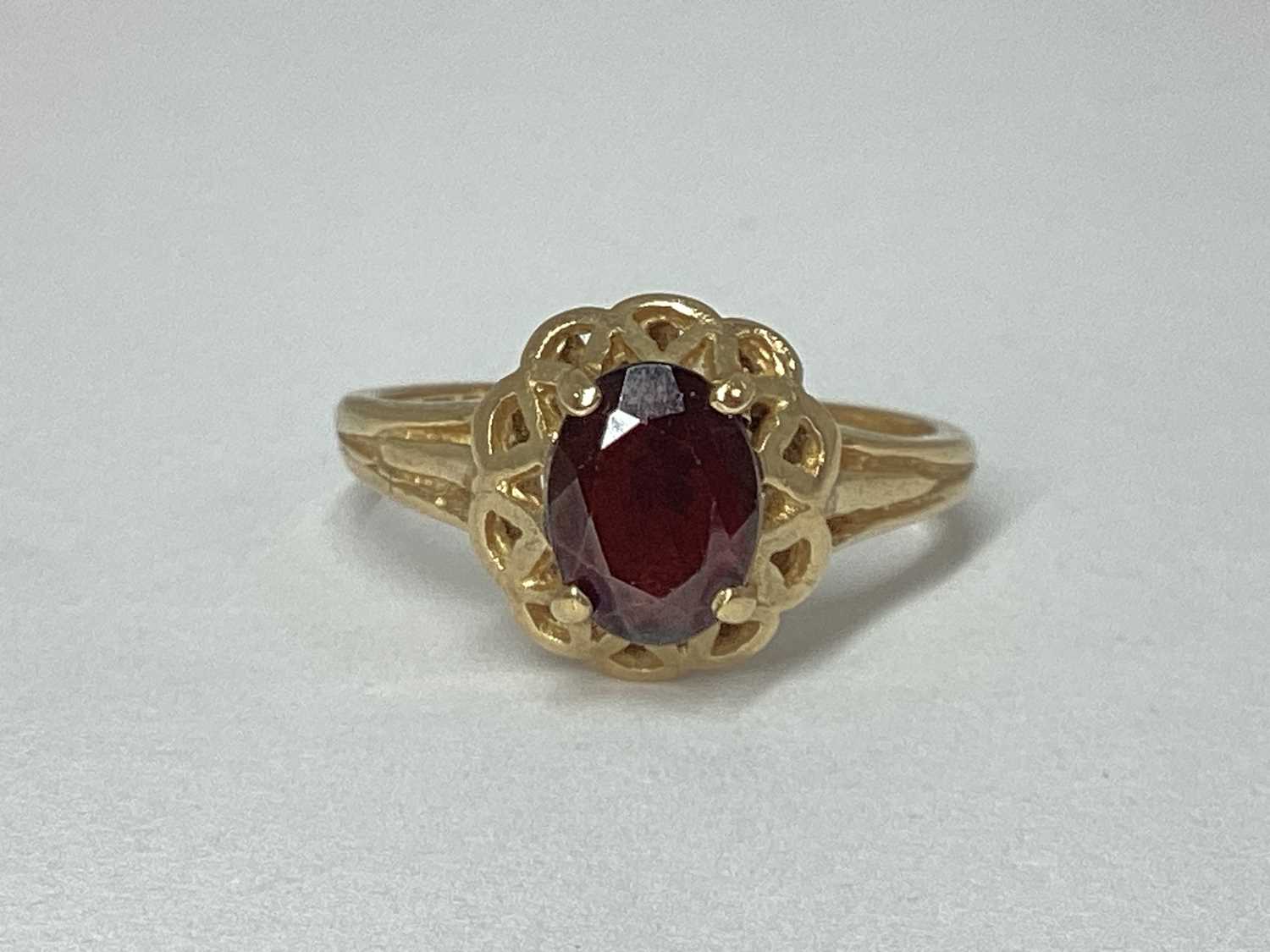 Lot 73 - A 9ct Gold Dress Ring, oval claw set, within...