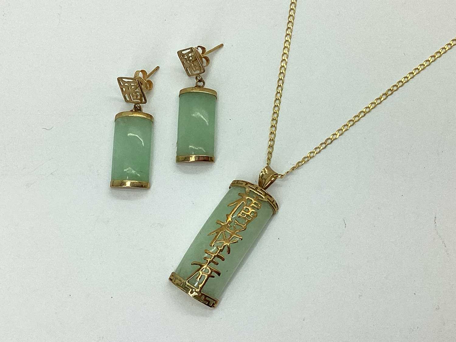 Lot 87 - A Modern Jade Pendant, with applied Chinese...