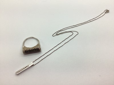 Lot 240 - A Modern Diamond Set Line Pendant, channel set...