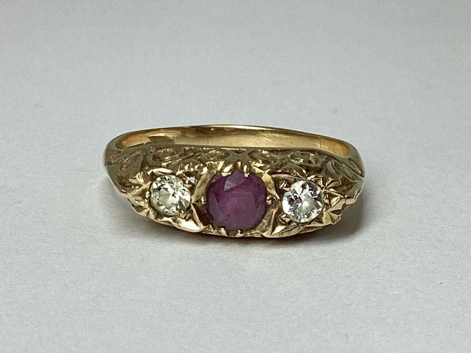 Lot 84 - A 9ct Gold Three Stone Ring, claw set within...
