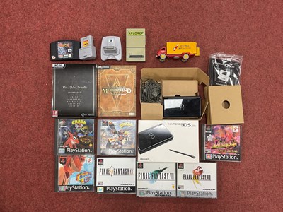 Lot 750 - A Nintendo DS Lite Handheld Gaming Console,...