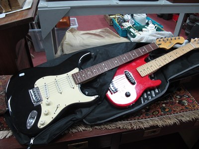 Lot 1153 - Black Legato electric guitar with a smaller...