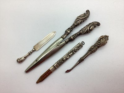 Lot 127 - A Hallmarked Silver Page Marker, glove...