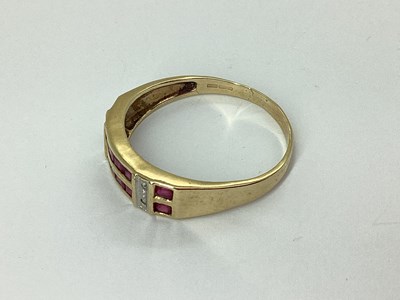Lot 61 - A Modern 9ct Gold Channel Set Ring, the two...