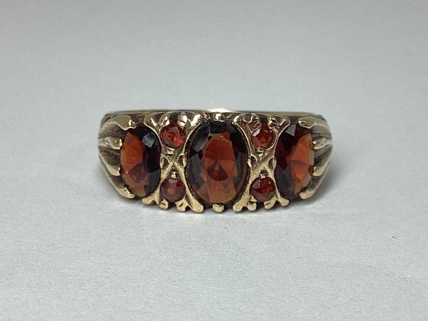 Lot 50 - A 9ct Gold Oval Three Stone Ring, of graduated...