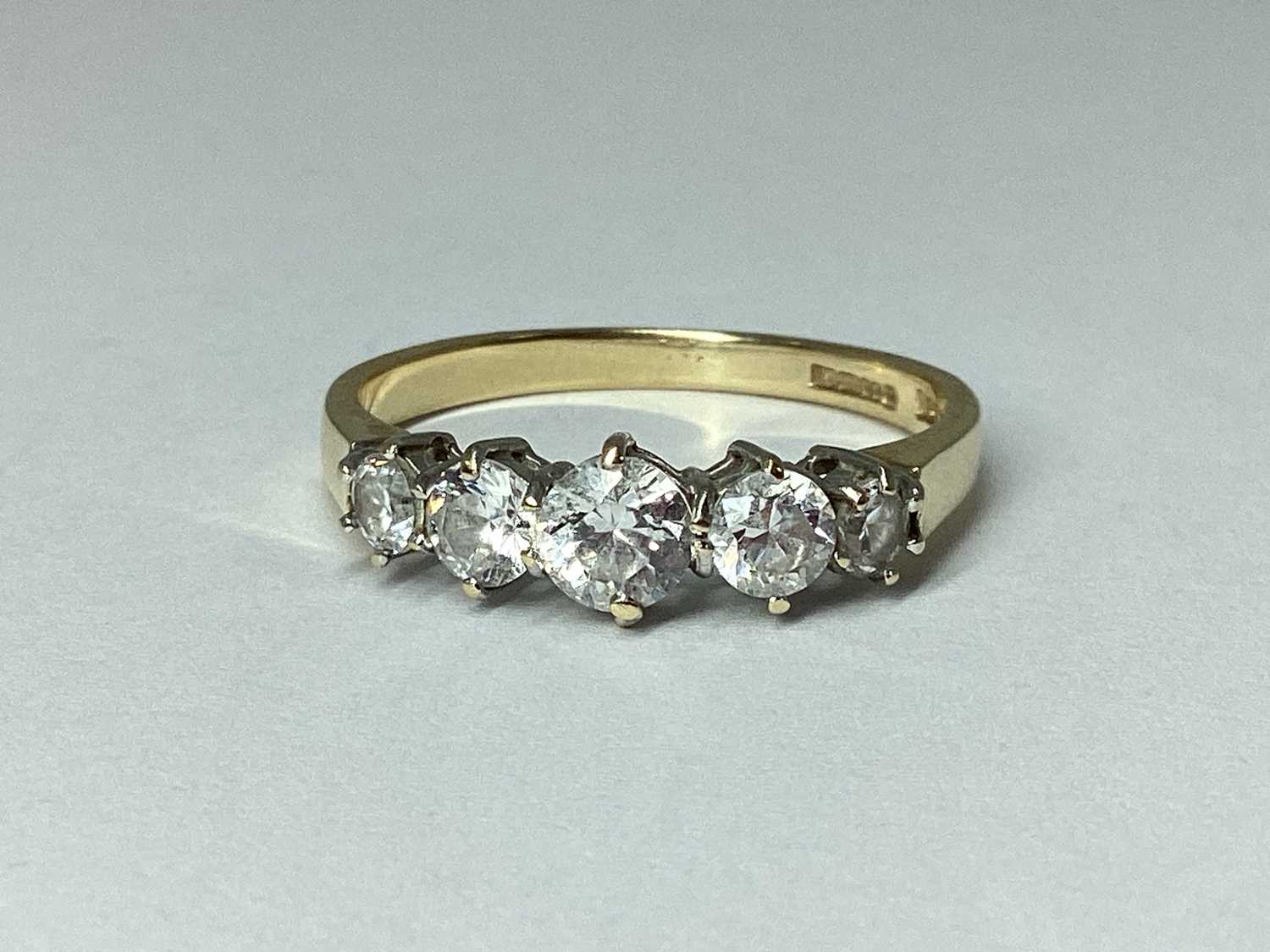 Lot 79 - QVC; A CZ Set Five Stone Ring, the graduated...