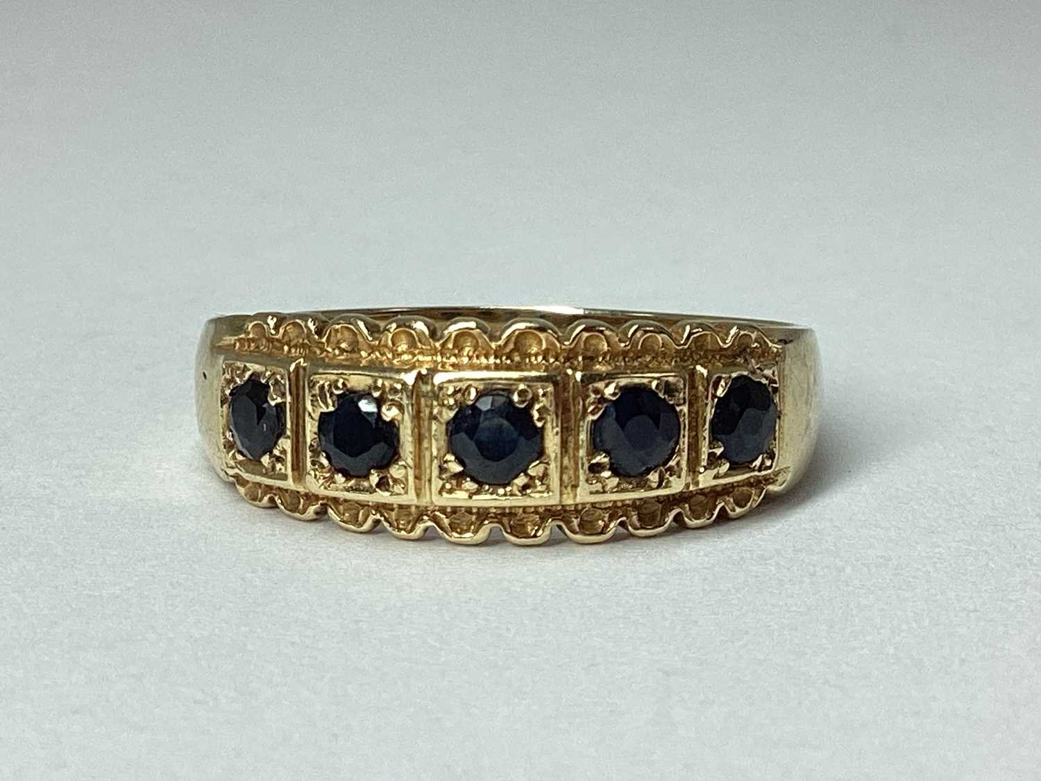Lot 56 - A 9ct Gold Five Stone Ring, inset within...