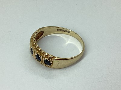 Lot 56 - A 9ct Gold Five Stone Ring, inset within...