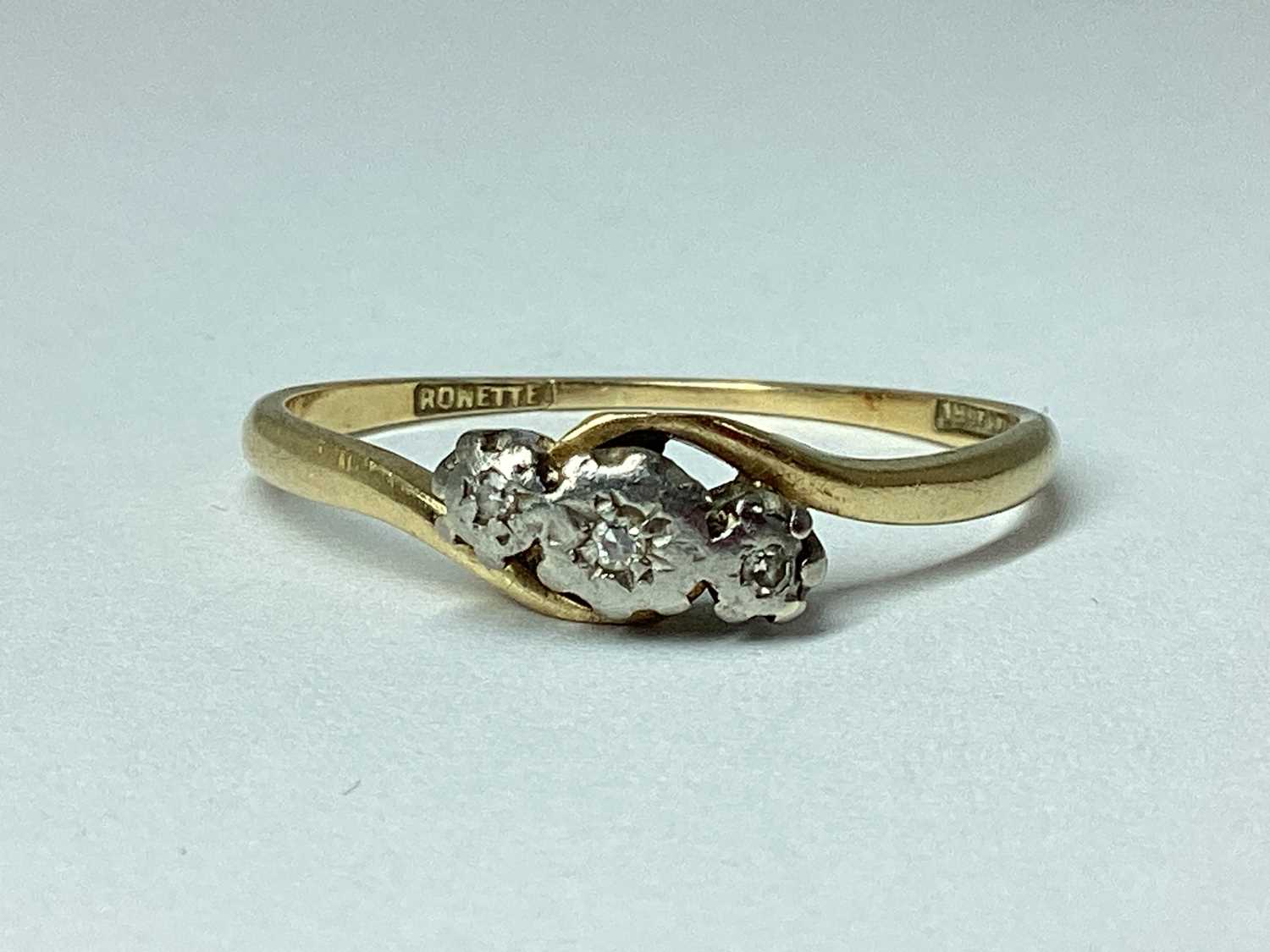 Lot 75 - An Illusion Set Three Stone Ring, of crossover...