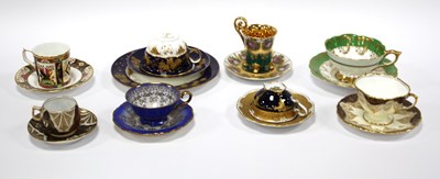 Lot 1205 - A collection of teacups and saucers to include...