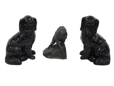 Lot 1394 - Pair of Black Glaze Terracotta Spaniel Dogs,...