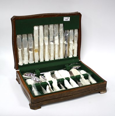 Lot 1257 - A vintage wooden cased canteen of silver...