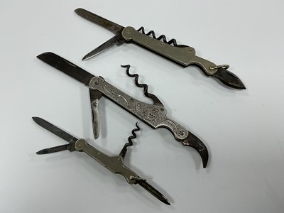 Lot 411 - Three Multi Function Folding Pocket Knives,...