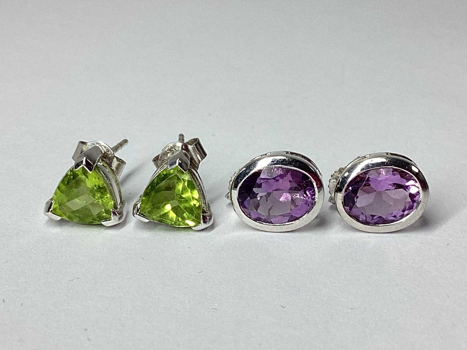 Lot 74 - A Pair of 9ct White Gold Oval Collet Set Stud...