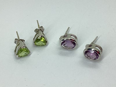 Lot 74 - A Pair of 9ct White Gold Oval Collet Set Stud...