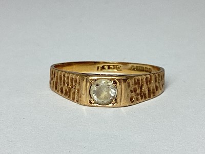Lot 52 - A 9ct Gold Ring, inset between tapering...