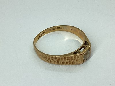 Lot 52 - A 9ct Gold Ring, inset between tapering...