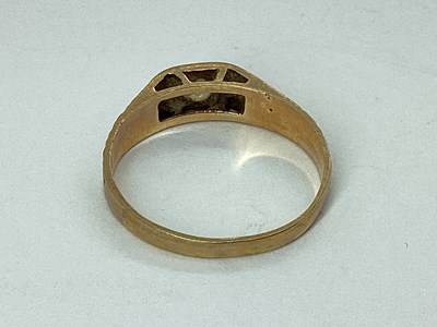 Lot 52 - A 9ct Gold Ring, inset between tapering...