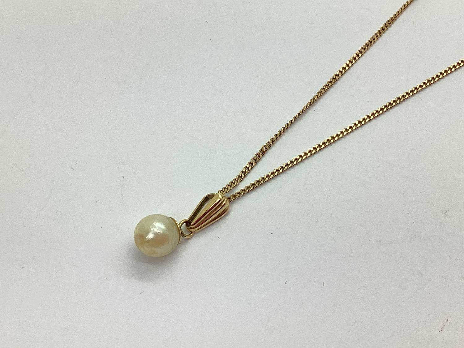 Lot 60 - A Dainty Pearl Pendant, (indistinctly stamped)...