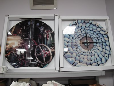 Lot 1130 - Two large circular glass panel wall clocks by...