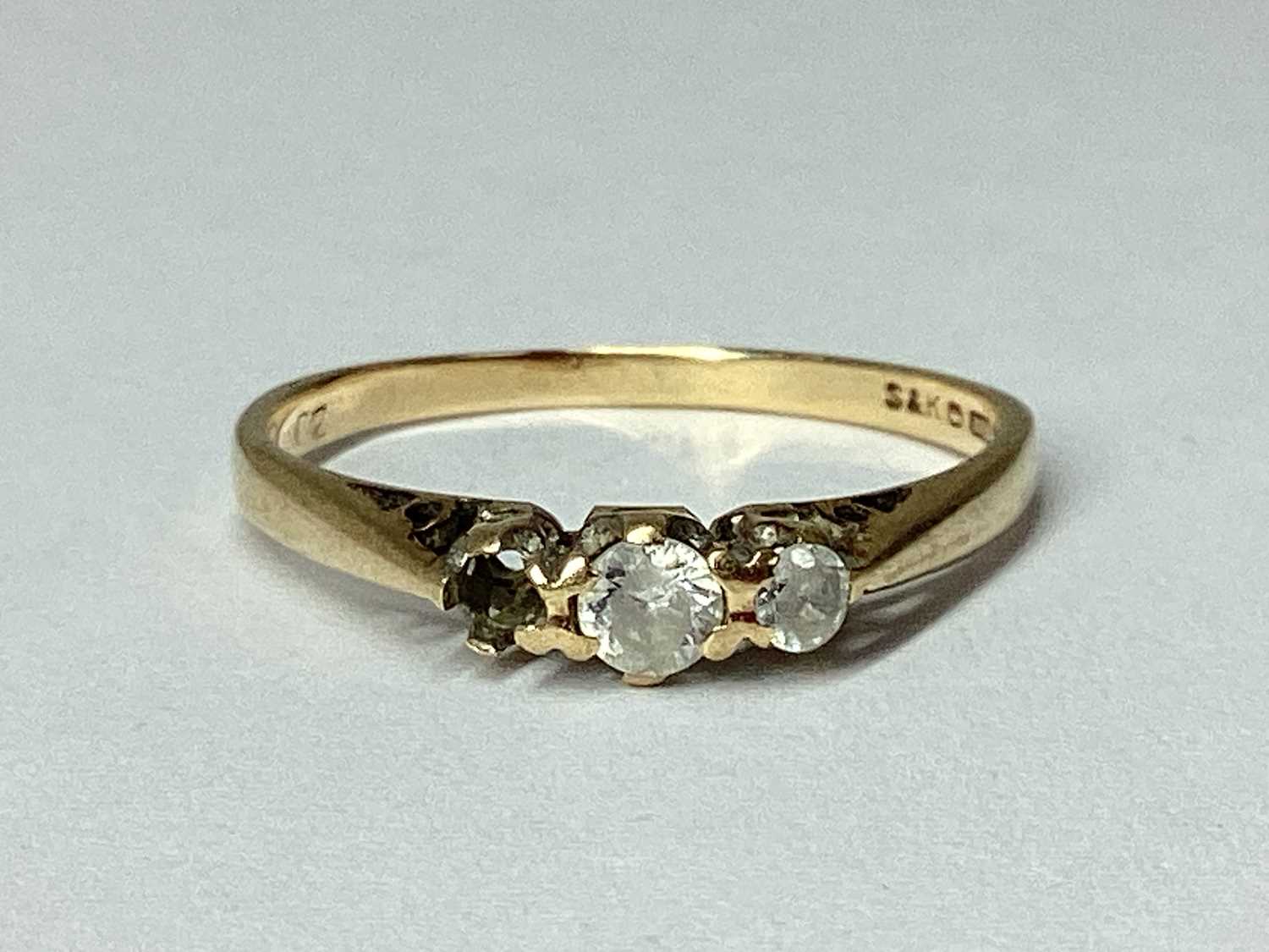Lot 51 - A 9ct Gold Three Stone Claw Set Ring, (one...