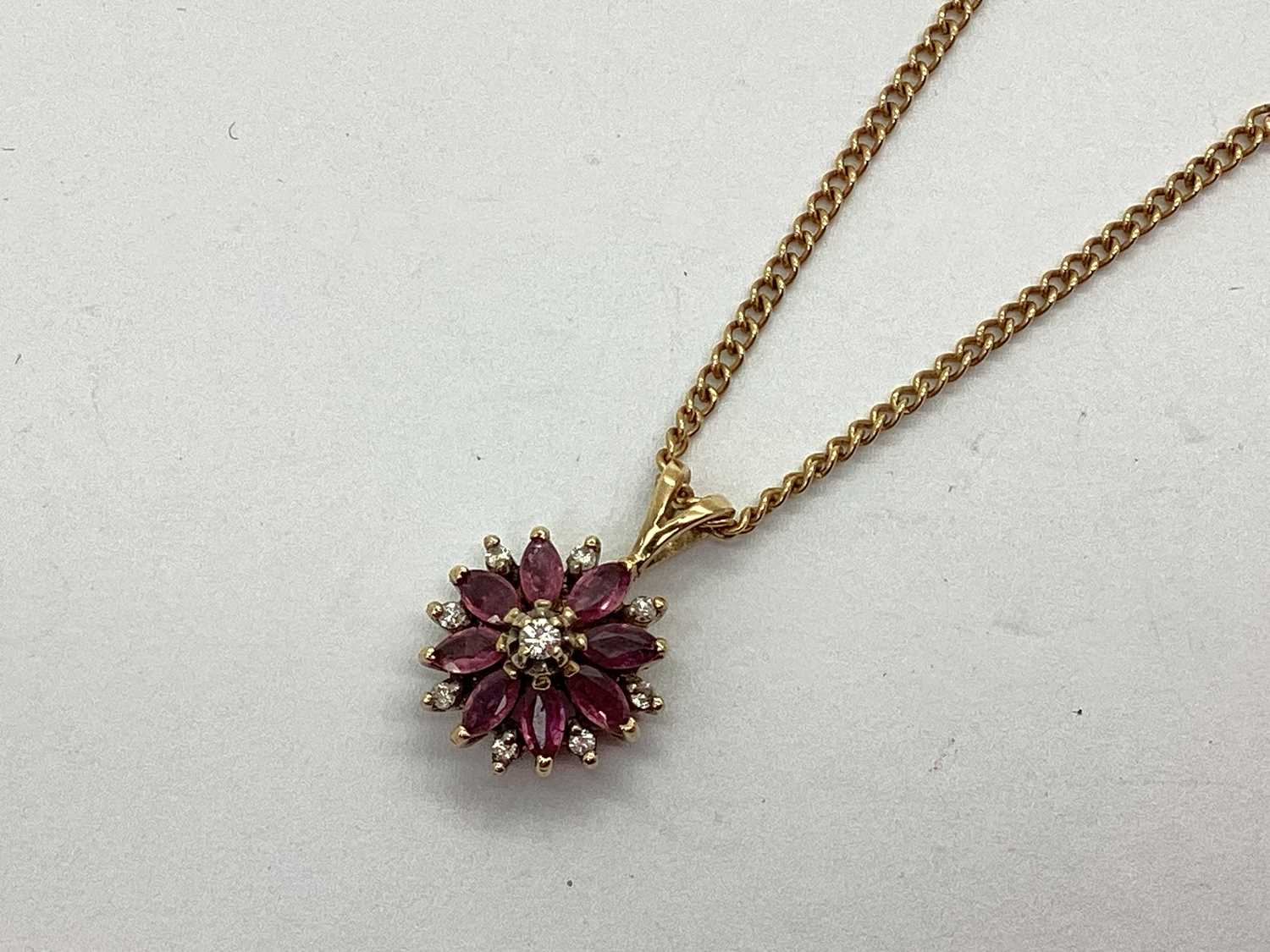 Lot 84 - A Decorative 9ct Gold Diamond Set Flowerhead...