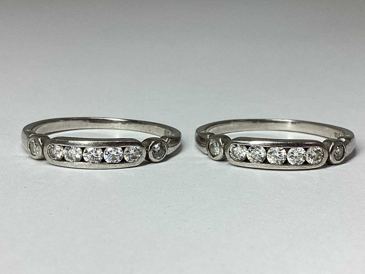 Lot 57 - Two Matching Round Brilliant Cut Diamond Rings,...