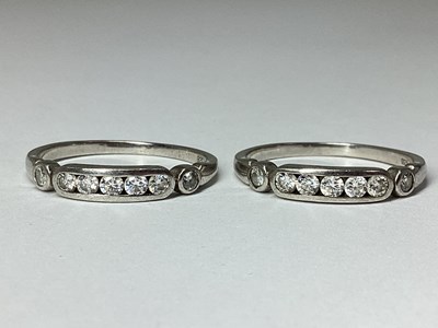 Lot 57 - Two Matching Round Brilliant Cut Diamond Rings,...