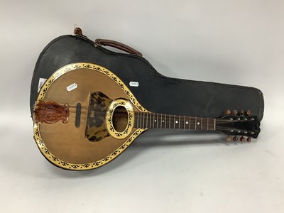 Lot 1545 - A cased vintage mandolin, featuring...