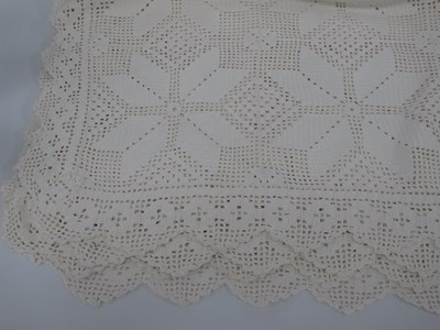 Lot 1415 - A large hand-crocheted bedspread, square...