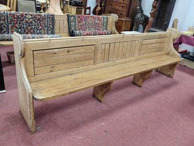 Lot 1560 - Pine Church Pew, with a panelled back, shaped...