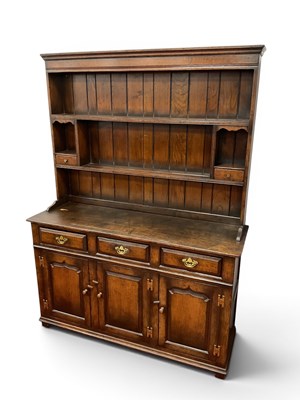Lot 1459 - An XVIII Century Style Oak Dresser, rack with...