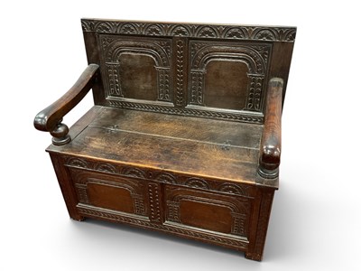 Lot 1463 - A XVII Century Style Oak Box Settle, with a...