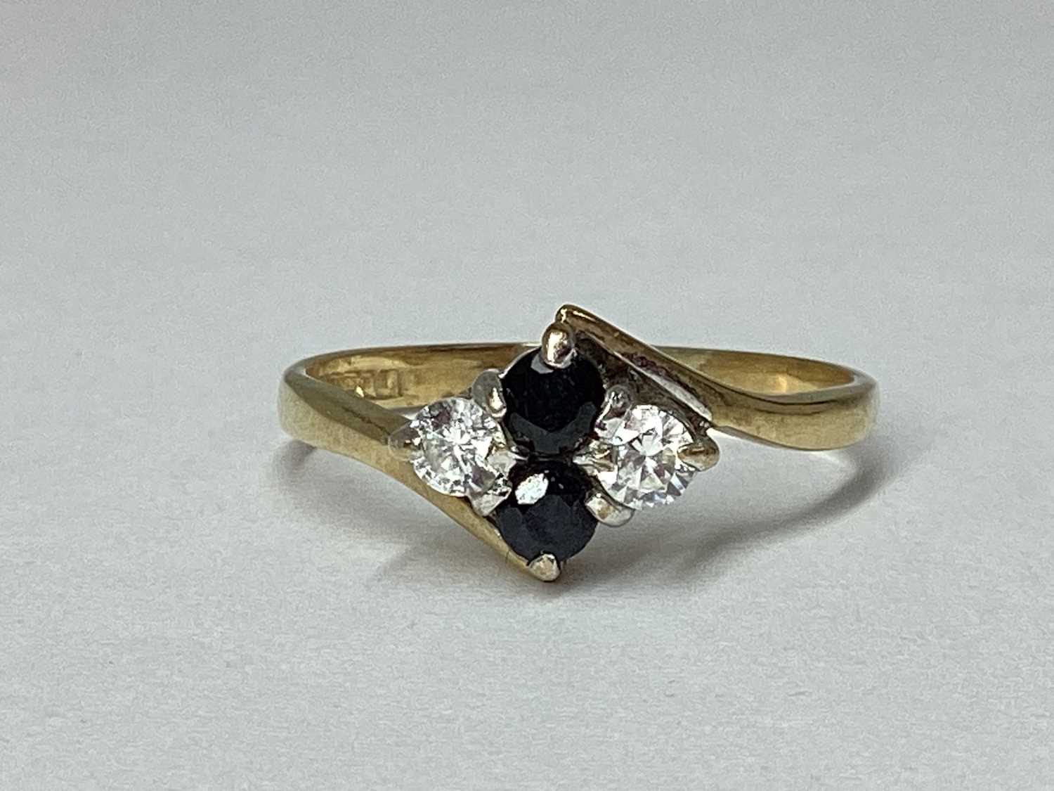 Lot 49 - A Dainty 9ct Gold Stone Set Twist Ring, the...